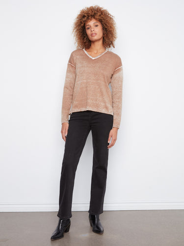 Stylish long sleeves add elegance to this washed finish sweater, ideal for cooler days. By Charlie B.