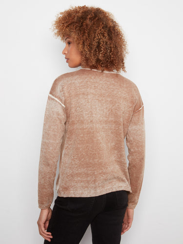 A unique washed finish gives this sweater an effortlessly cool vibe. By Charlie B.