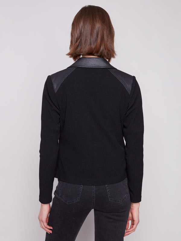 Rib knit back adds comfort to this fashionable black faux leather jacket by Charlie B.