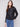 Black faux leather jacket featuring a stylish hook-and-eye closure for added elegance by Charlie B.
