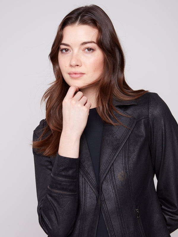 Fashionable faux leather jacket designed with practical faux pockets and zipper details by Charlie B.