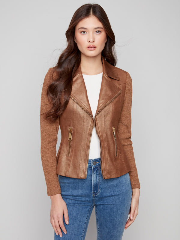 Faux pockets with zippers enhance the modern appeal of this copper jacket by Charlie B.