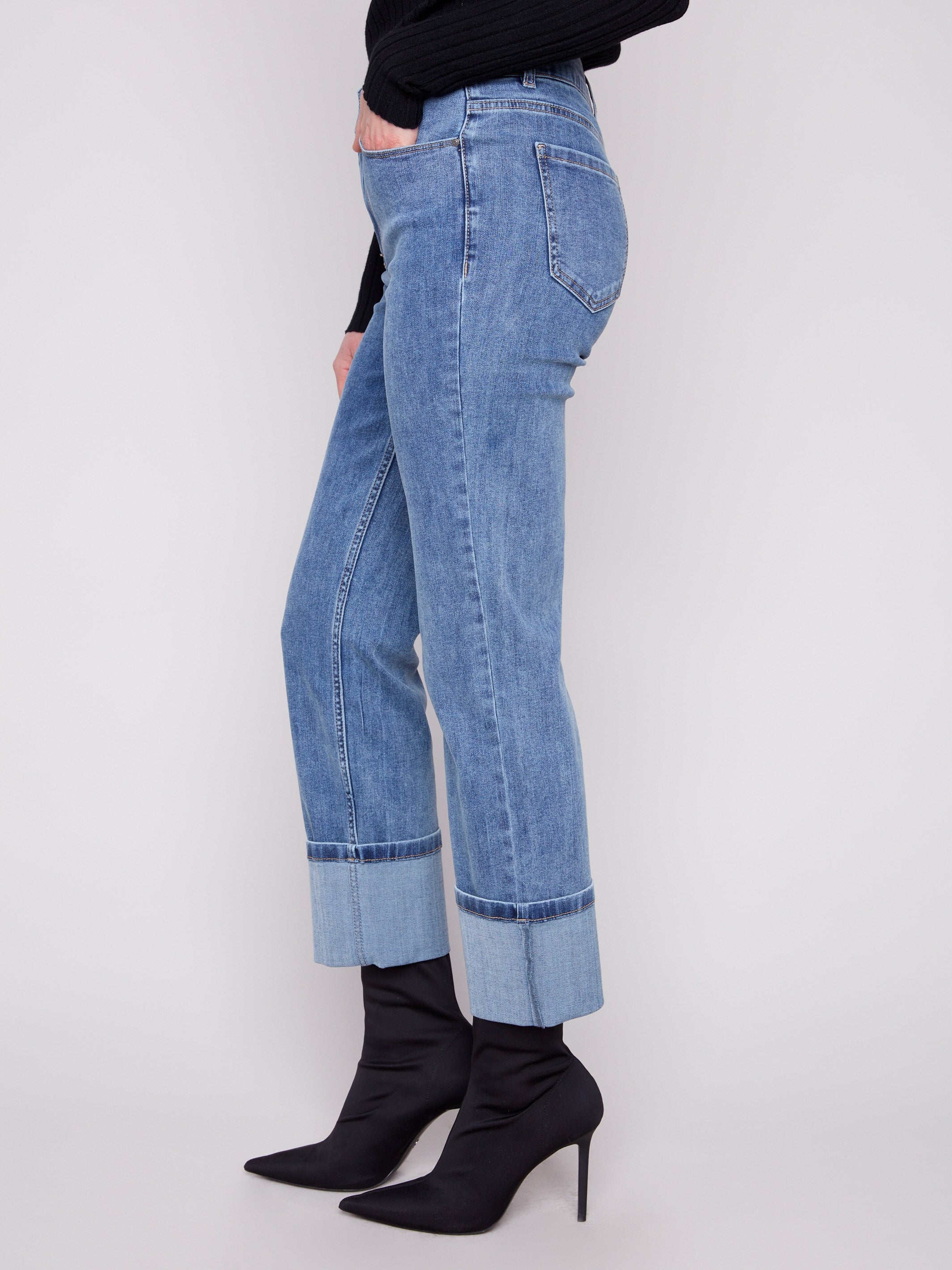 Denim jeans with wide cuffs at the hem, offering a chic look with added stretch for flexibility by Charlie B.