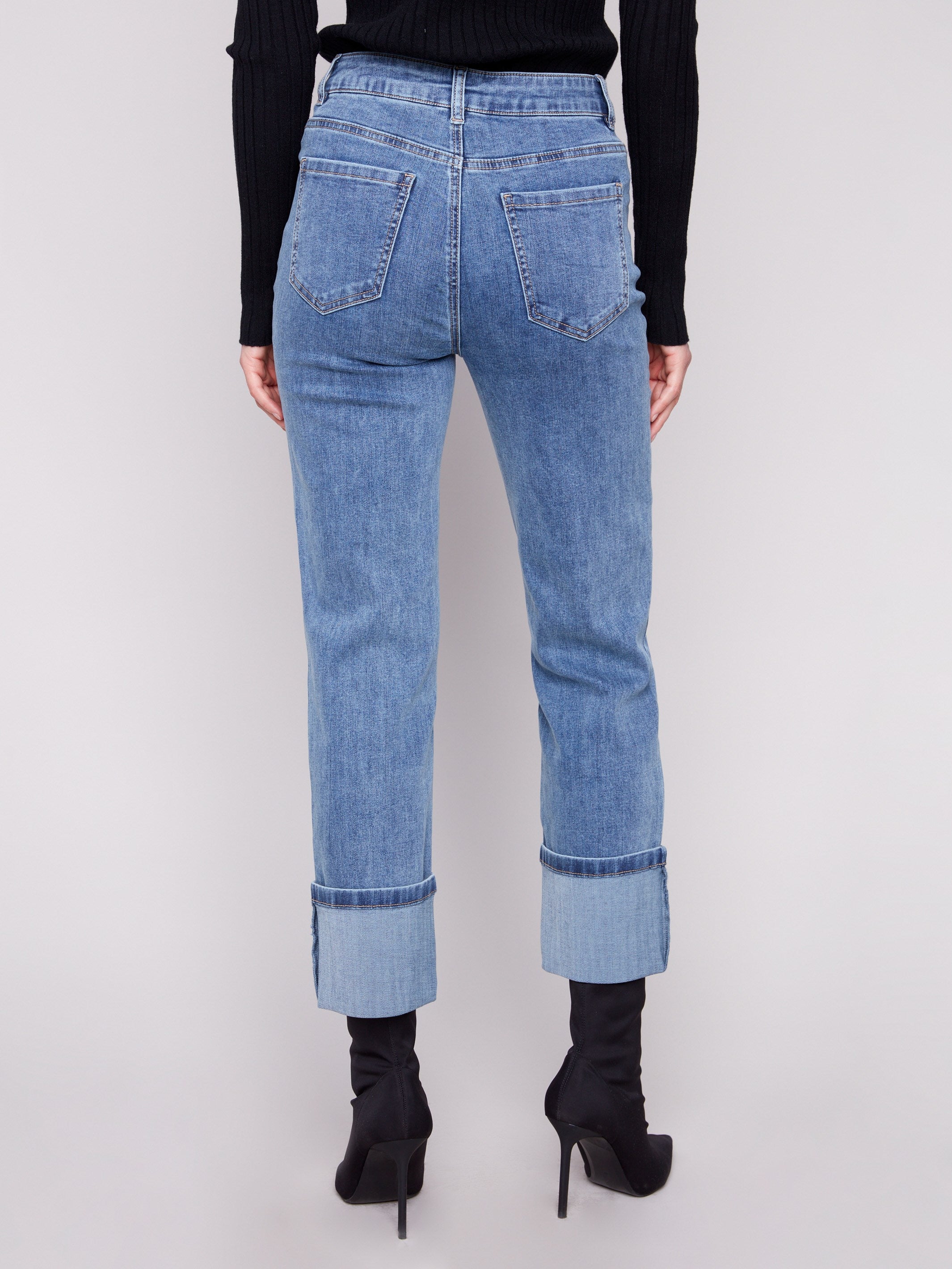 These medium blue jeans have a regular rise and durable stretch denim fabric, perfect for versatile styling by Charlie B.