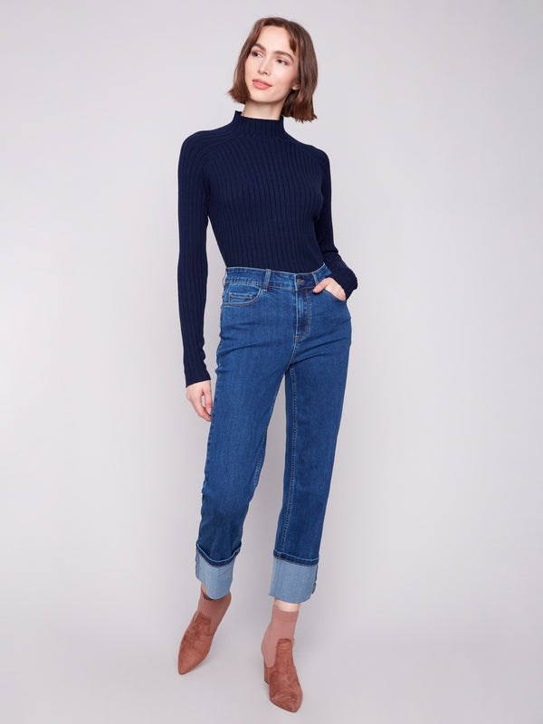 Indigo straight leg jeans with wide cuffs, featuring a classic five-pocket design and button closure by Charlie B.