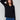 Elegant black sweater with wide cuffs featuring button accents, perfect for a stylish look by Charlie B.