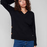Elegant black sweater with wide cuffs featuring button accents, perfect for a stylish look by Charlie B.