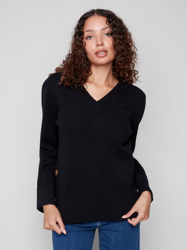 Sophisticated V-neck sweater in black with unique button details for added flair by Charlie B.