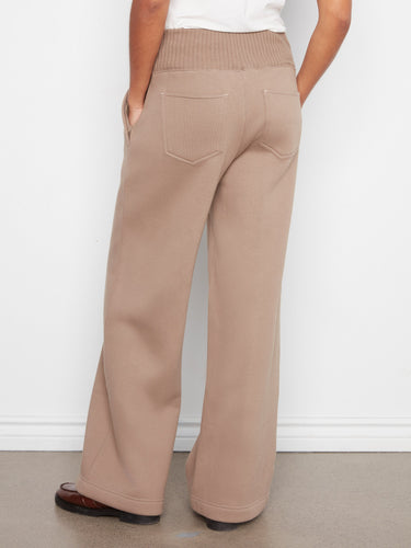 Back patch pockets on these pants offer additional storage while maintaining a sleek appearance. Tailored by Charlie B.