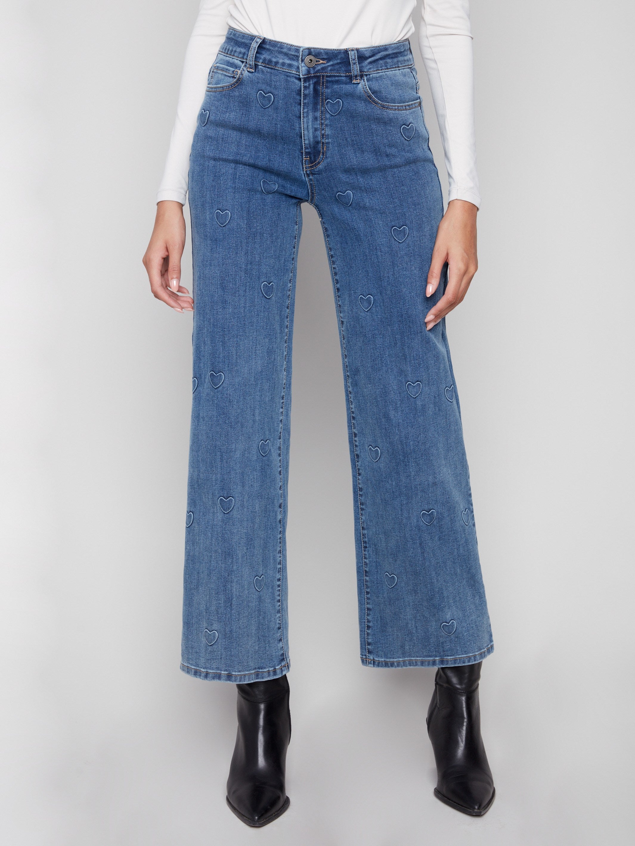 These stretch denim jeans with embossed hearts provide comfort and style, perfect for any casual outing by Charlie B.