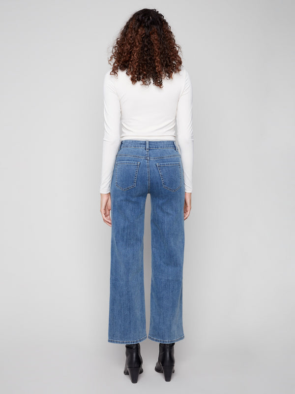 Stylish blue wide-leg jeans highlighted by their unique five-pocket design and heart accents by Charlie B.
