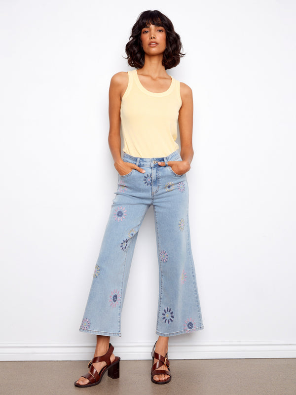 Denim pants with a cropped length and pixelated flower embroidery, featuring a regular rise. Made from stretch denim for comfort by Charlie B.