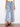 These jeans showcase a vibrant pixelated flower embroidery, crafted in stretch denim material with a five-pocket design by Charlie B.