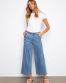 Soft blue wide-leg jeans with stretch denim, offering comfort and style, featuring a cropped length by Charlie B.
