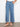 Denim pants in soft blue with scalloped edges, offering slash pockets and a flattering fit by Charlie B.