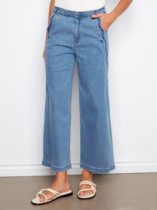 Blue wide-leg jeans with regular rise and slash pockets, adding functionality to the chic design by Charlie B.