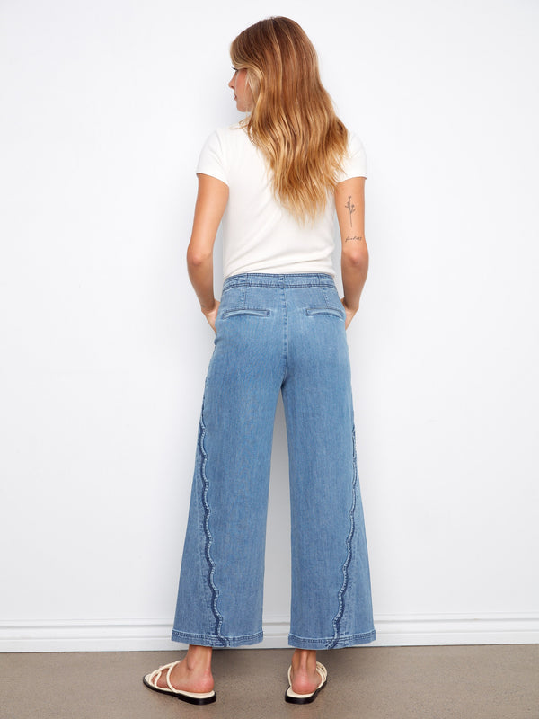 Cropped length blue jeans with stylish stretch denim for easy movement and comfort by Charlie B.