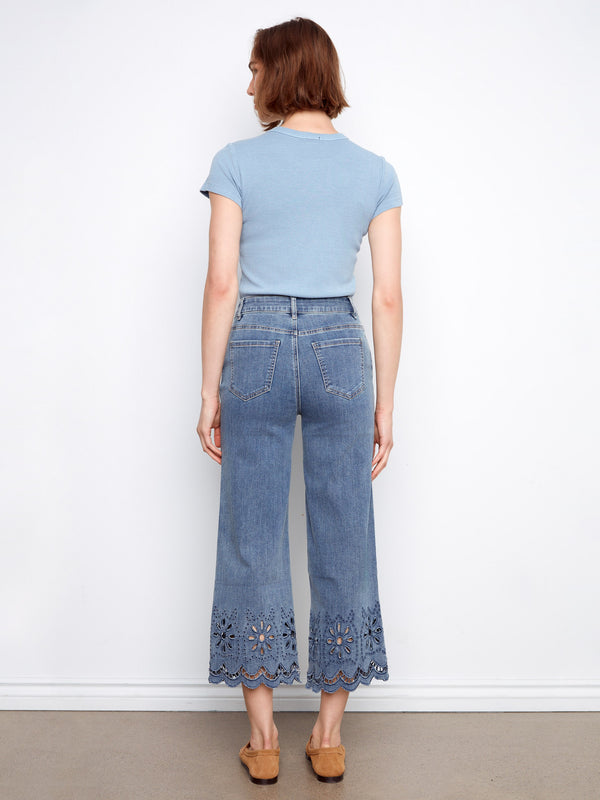 Stretch denim pants with a regular rise and intricate scalloped eyelet hem, offering both comfort and elegance by Charlie B.