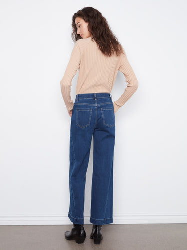 The side panel detail adds a unique touch to these stylish denim jeans, enhancing their overall look. By Charlie B.