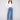 Medium blue jeans featuring a wide leg design with elegant patterned studs, crafted from stretch denim material by Charlie B.
