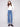 Regular rise medium blue jeans with artistic patterned studs at the hem, perfect for versatile styling by Charlie B.