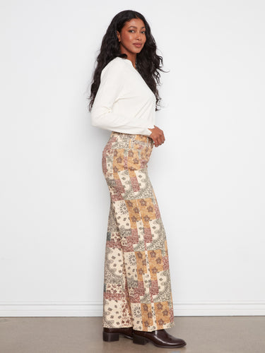 Designed in stretch twill fabric, these wide leg pants showcase a unique bandana print and regular rise by Charlie B.