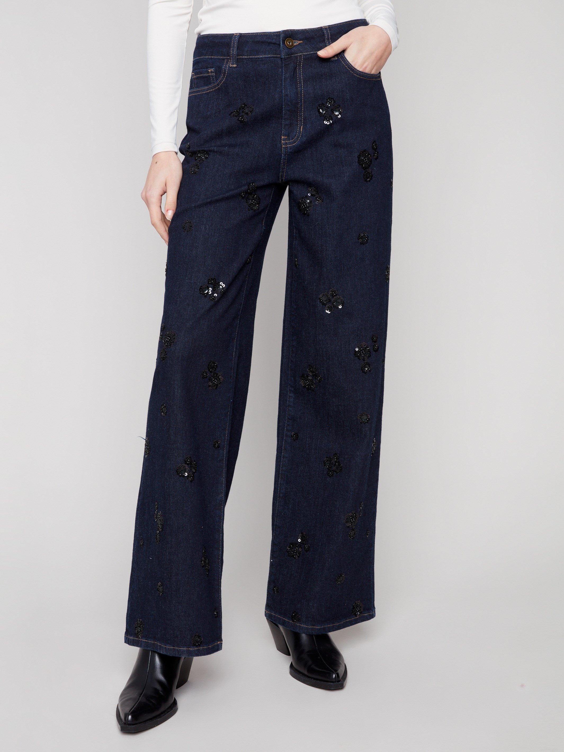 Long length denim trousers with intricate sequin floral embroidery, offering a touch of elegance by Charlie B.