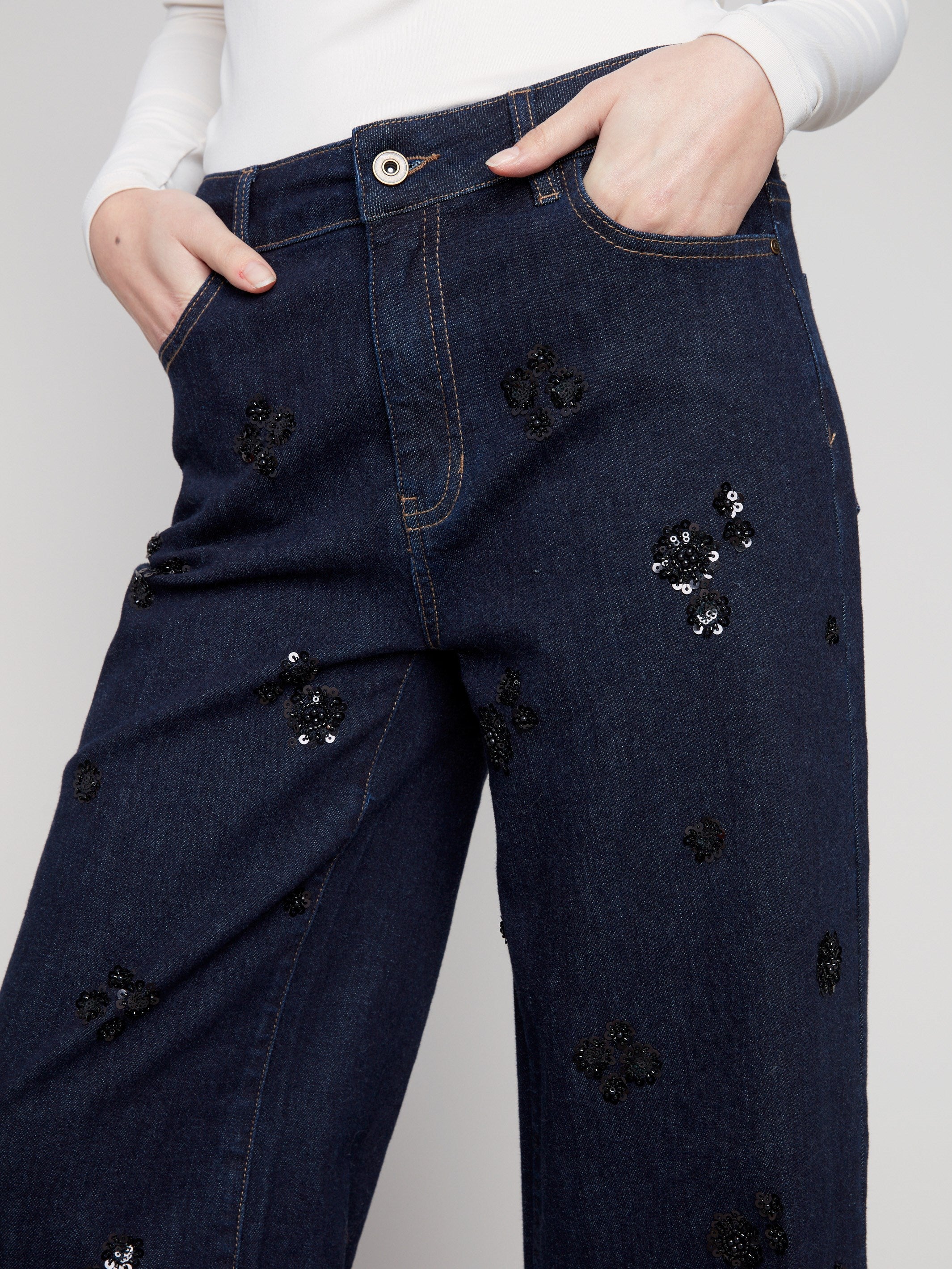 Stylish five-pocket design on these deep blue jeans, perfect for carrying essentials with ease by Charlie B.
