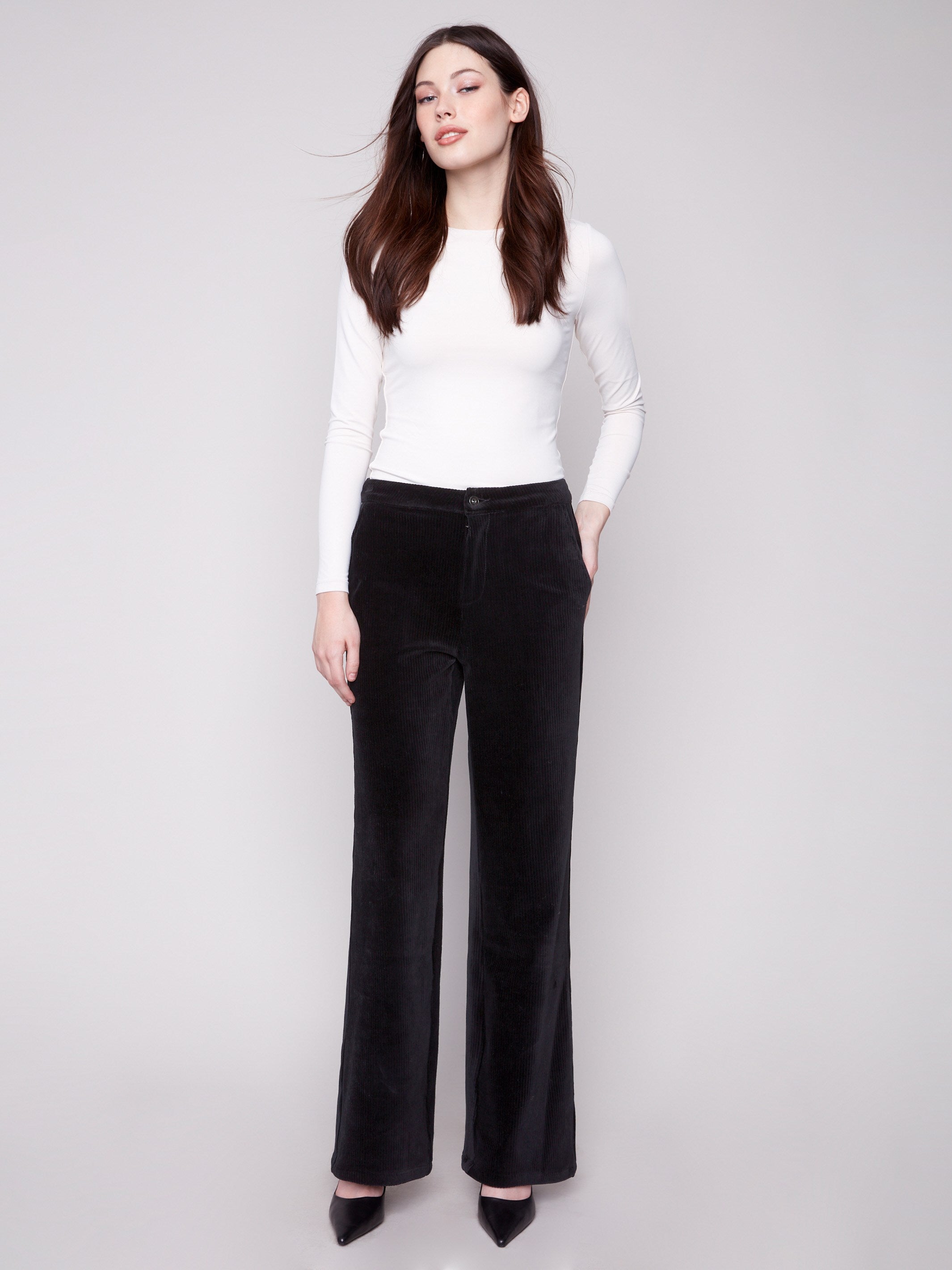 Black wide-leg pants featuring a long length and crafted from stretch corduroy for comfort by Charlie B.