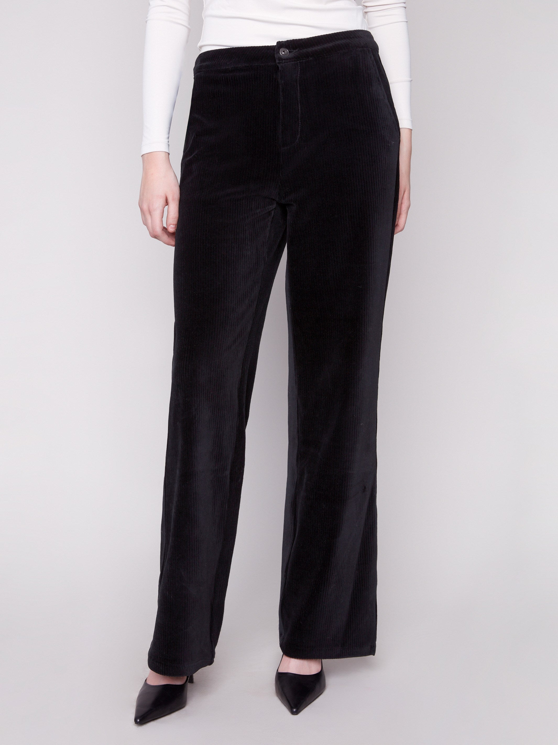 These black pants offer side and back pockets, combining style with functionality by Charlie B.