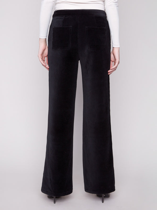Black wide-leg pants designed with a sleek silhouette and long length for an elegant look by Charlie B.