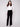 Featuring side and back pockets, these black wide-leg pants are both stylish and practical by Charlie B.