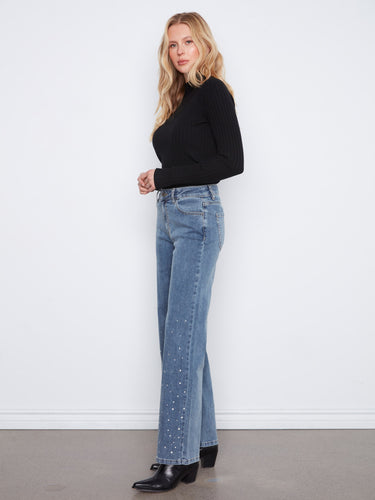 Classic 5-pocket styling enhances these denim pants, offering both functionality and fashion-forward appeal by Charlie B.