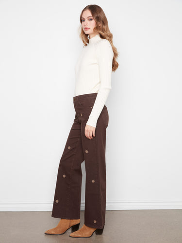 Crafted from stretch twill fabric, these brown wide-leg pants boast intricate floral embroidery for added flair by Charlie B.