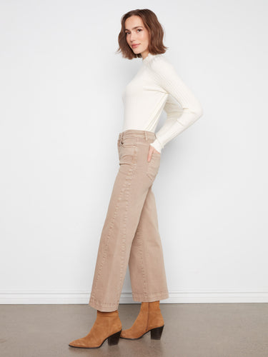 Wide leg twill pants in latte, styled with a white top and brown boots. The side panel detail adds flair by Charlie B.