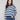 Navy striped sweater featuring drop shoulders and long sleeves, crafted in a soft knit by Charlie B.