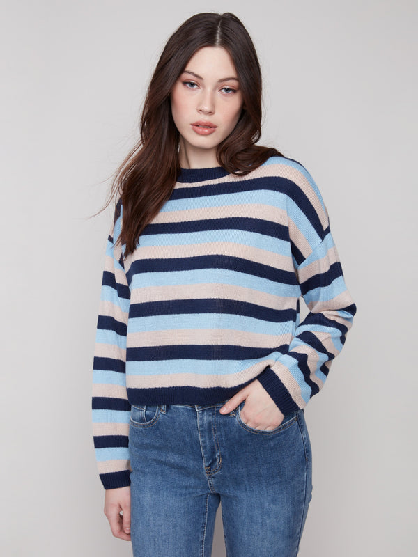 Navy striped sweater featuring drop shoulders and long sleeves, crafted in a soft knit by Charlie B.