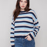 Navy striped sweater featuring drop shoulders and long sleeves, crafted in a soft knit by Charlie B.