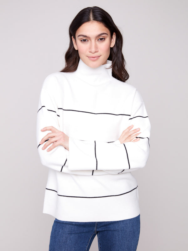 Ecru sweater with black stripes, showcasing a relaxed fit and stylish design by Charlie B.