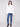 Chic ecru sweater featuring long sleeves and elegant black stripes by Charlie B.