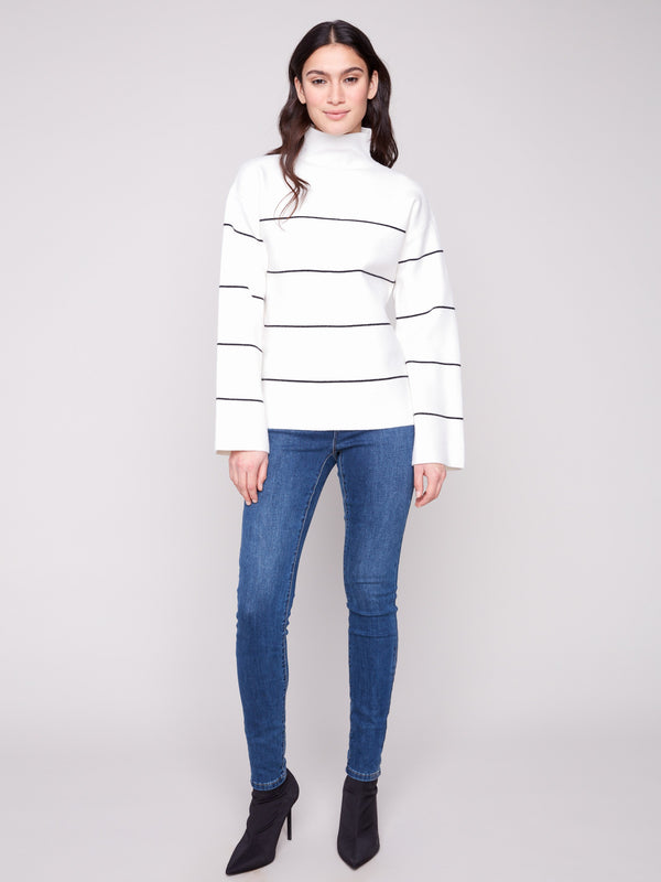 Chic ecru sweater featuring long sleeves and elegant black stripes by Charlie B.