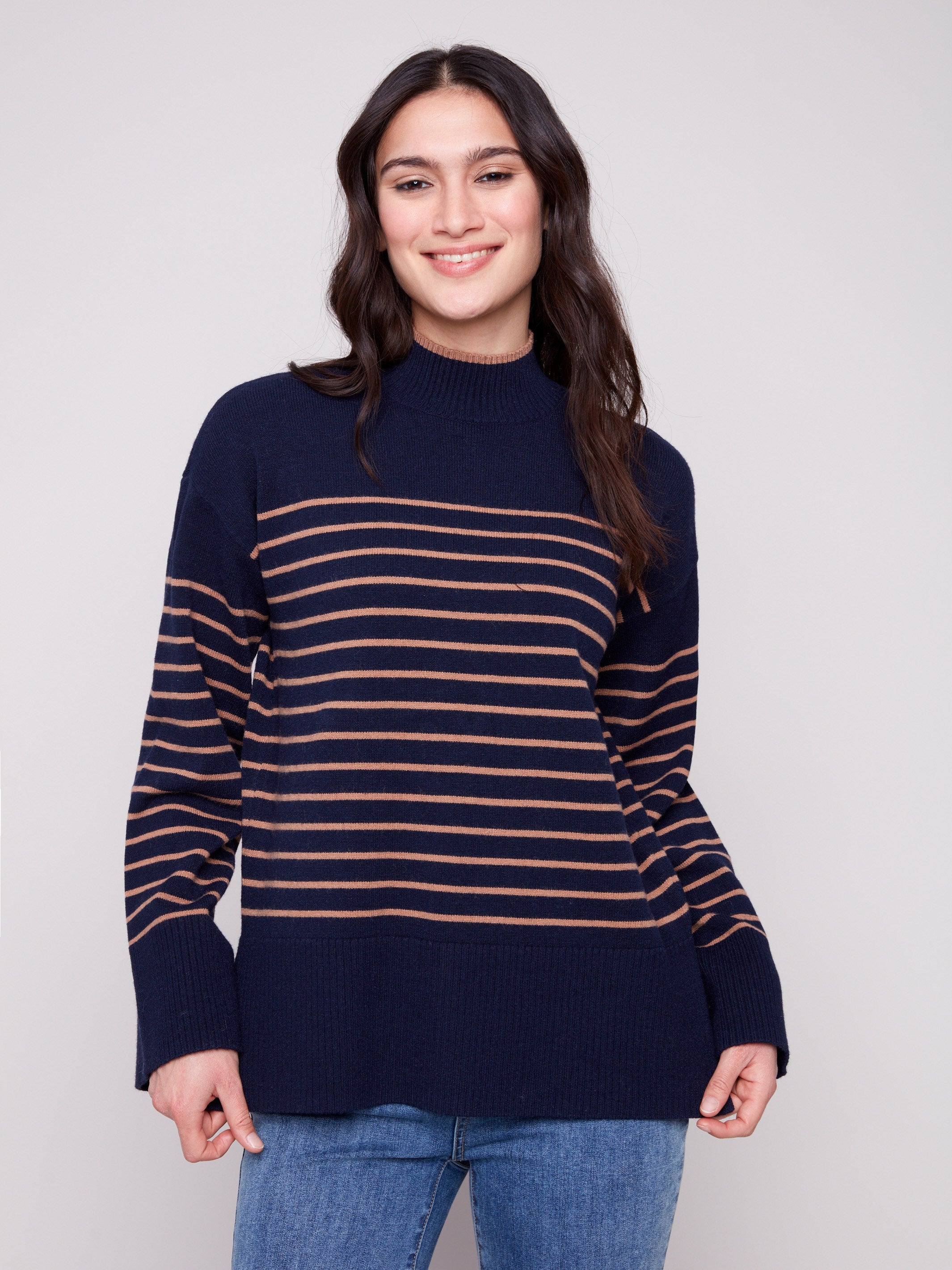 Navy blue striped sweater featuring a cozy mock neck, perfect for chilly days. Crafted with care by Charlie B.