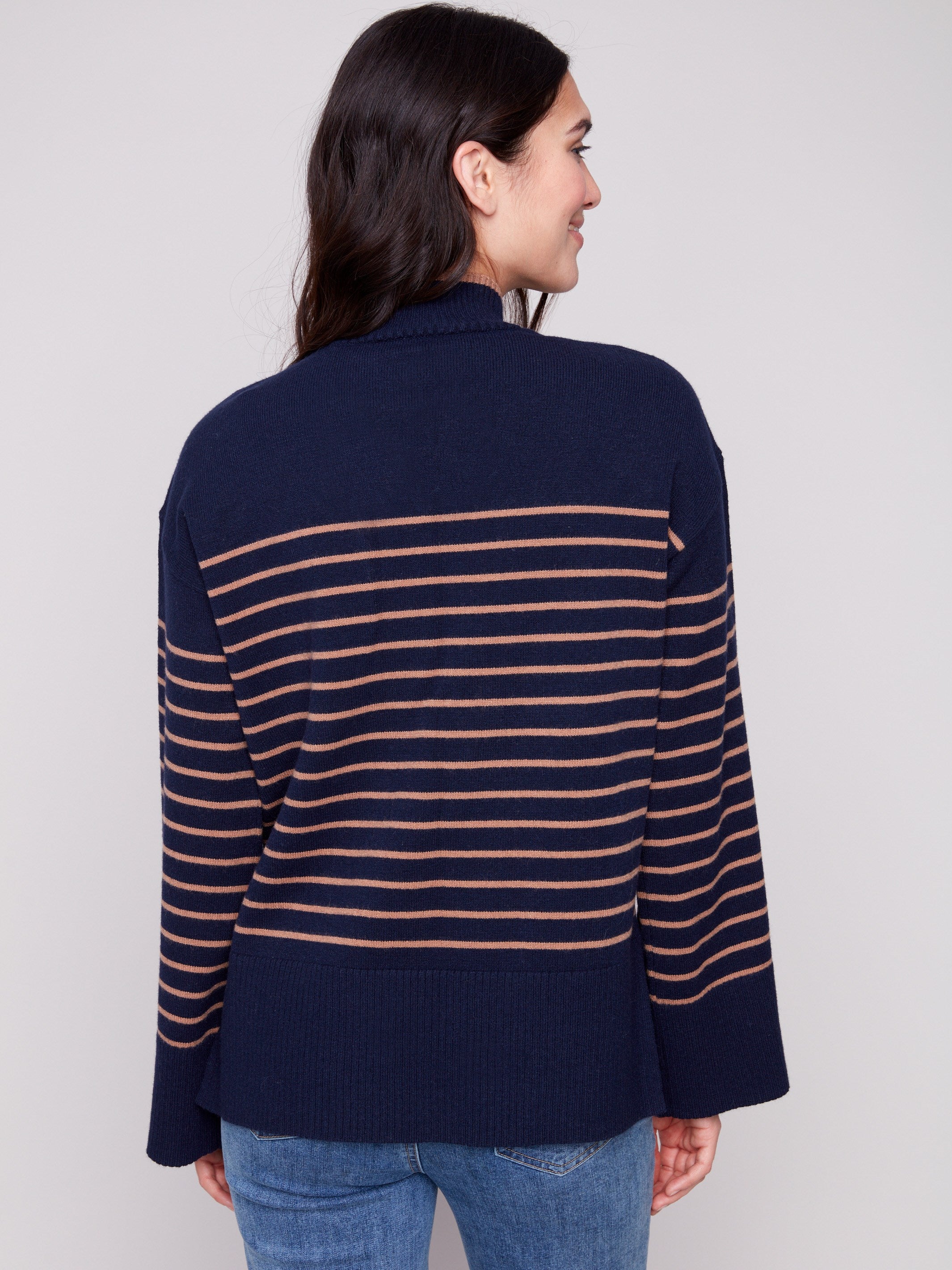 Chic navy striped sweater showcasing wide cuffs for added flair and comfort, designed by Charlie B.
