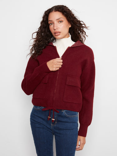 Designed with a convenient zip-front closure, this jacket combines style and functionality by Charlie B.