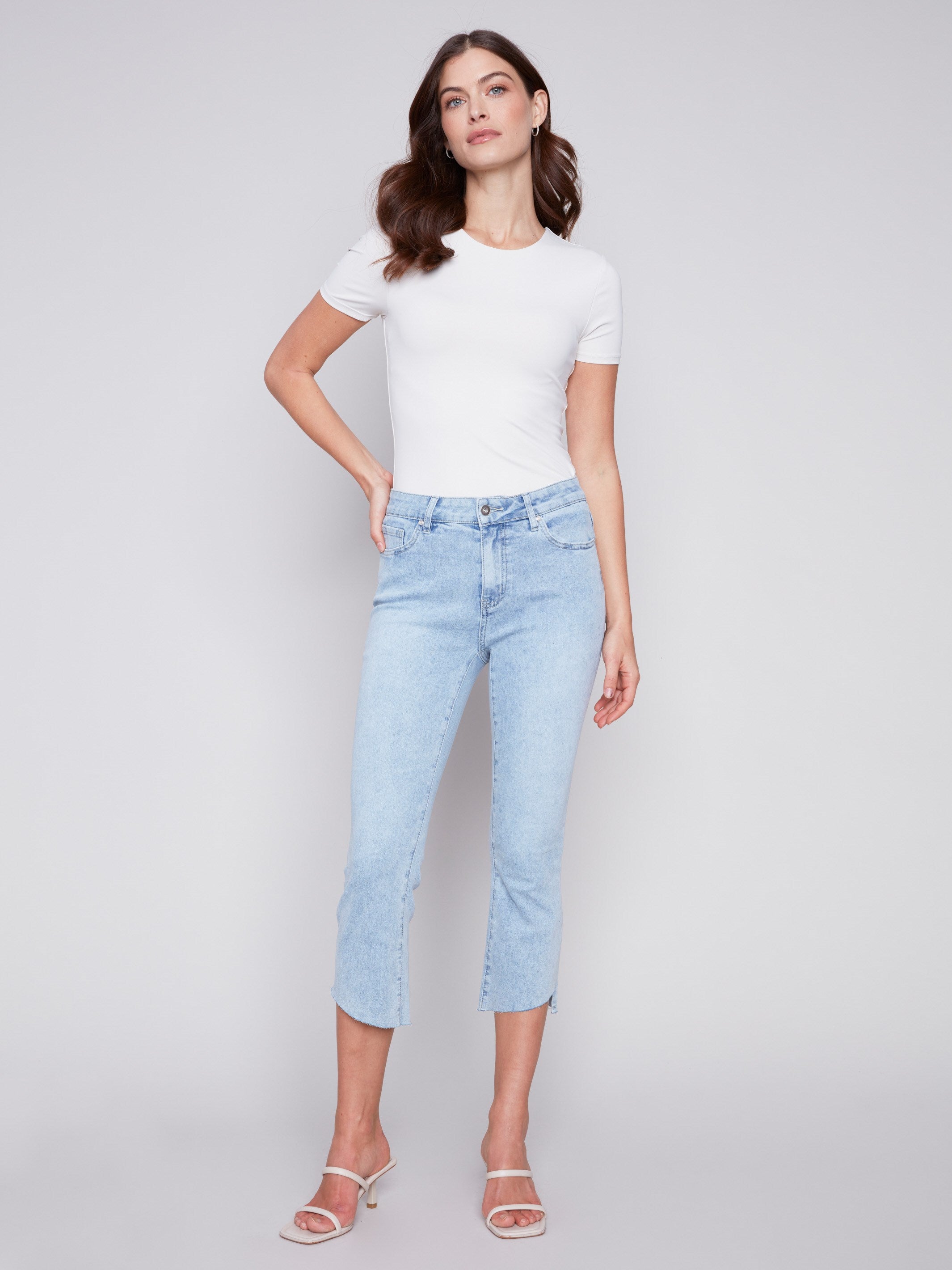 Charlie B Cropped Bootcut Jeans with Asymmetrical Hem - Bleach Blue - Image 1