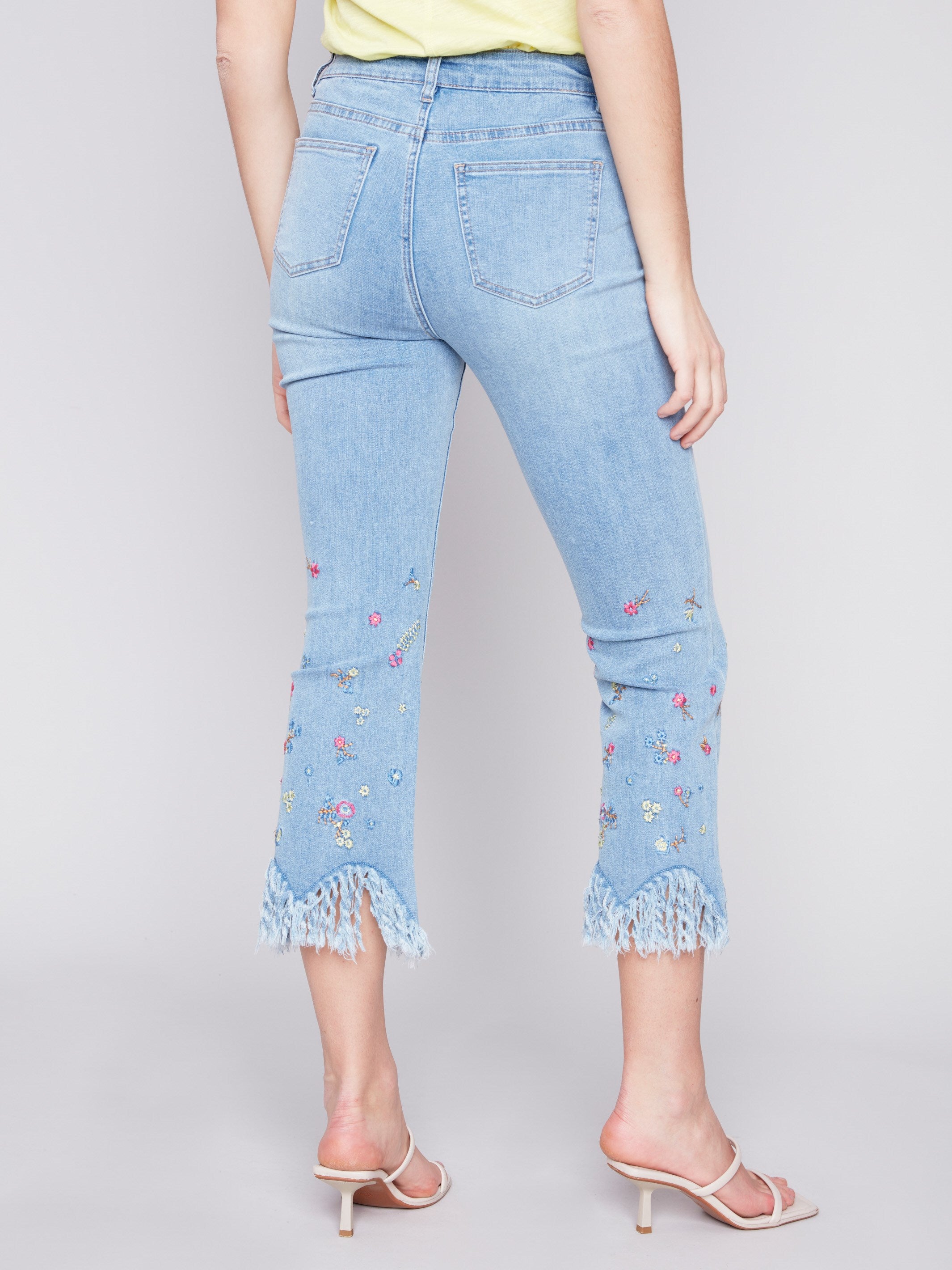 Charlie B Cropped Jeans with Embroidered Fringed Hem - Light Blue - Image 3